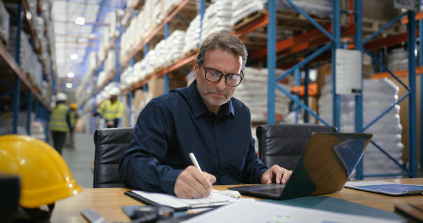 laptop writing and logistics with man in warehouse for shipping dispatch inventory checklist2204864011